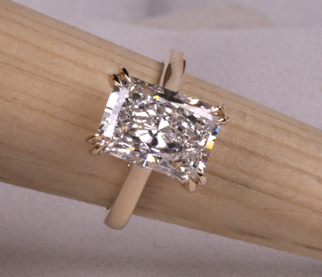 Emerald Cut Hidden Halo Diamond Ring